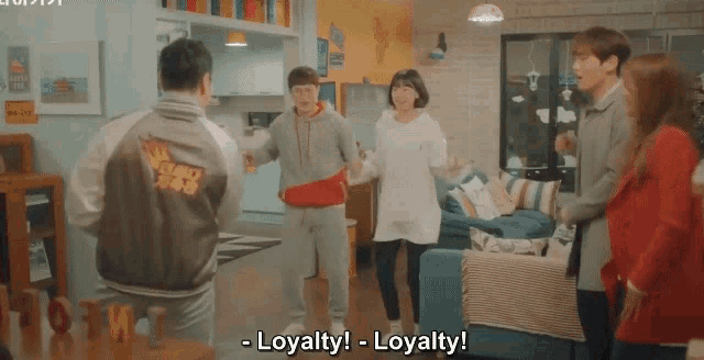 a group of people are dancing in a living room with loyalty written on the bottom