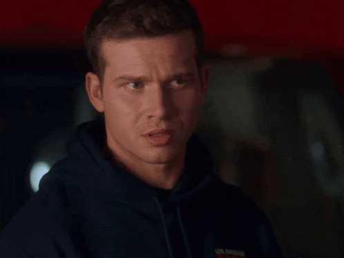 a man wearing a blue los angeles sweatshirt