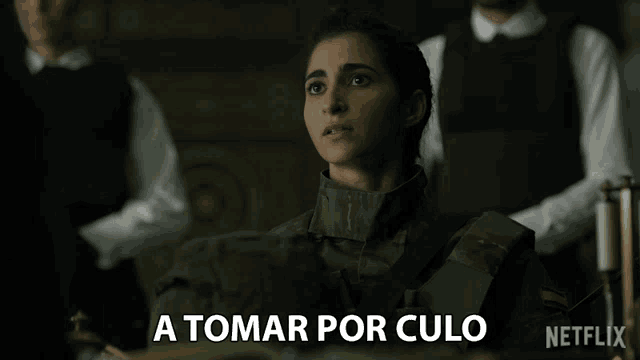 a woman in a military uniform says " a tomar por culo " in spanish