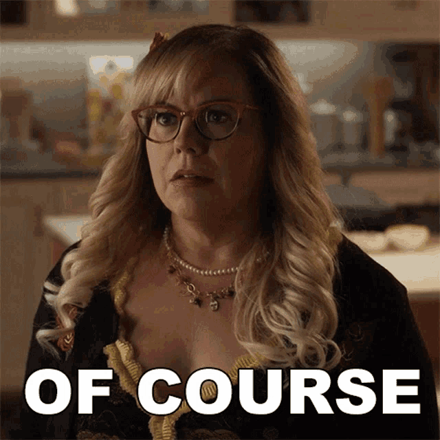 a woman wearing glasses and a necklace with the word of course on the bottom