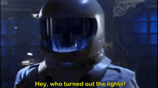 a person wearing a helmet with the words hey who turned out the lights