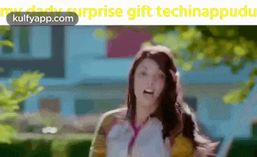 a woman is running in front of a house with the words surprise gift technappudu on the bottom .