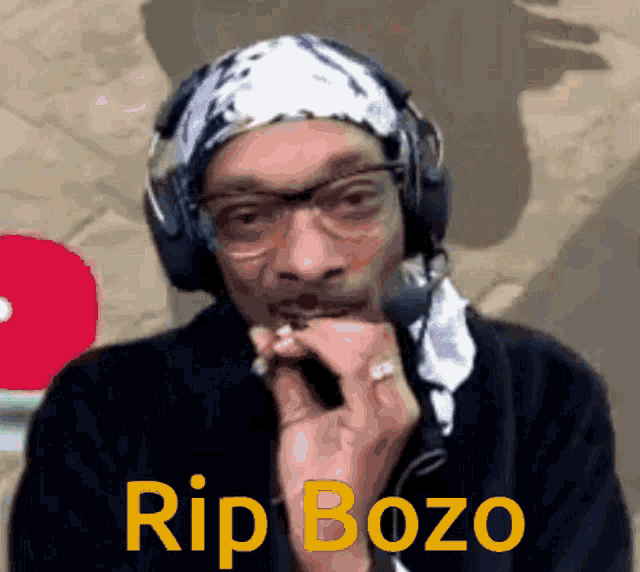 snoop dogg wearing headphones and a bandana says rip bozo on the bottom