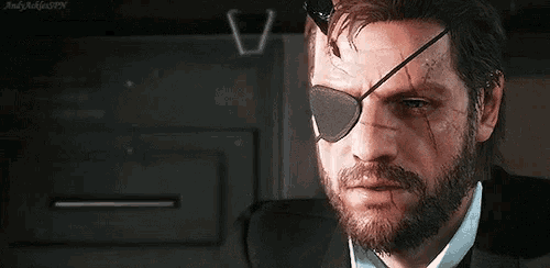 a man with a beard wearing sunglasses and a snake eye patch .
