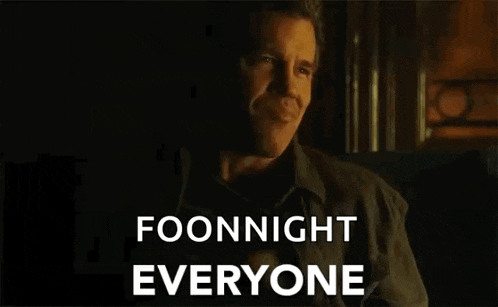 a man is sitting in a chair with the words `` foonnight everyone '' written on the screen behind him .