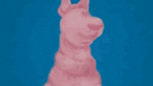 scooby doo is wearing a pink hat with bunny ears and a pink scarf .