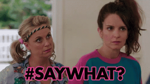 two women are standing next to each other and one of them is saying " say what " .