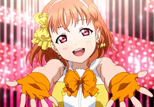 a girl with a bow on her head and orange gloves
