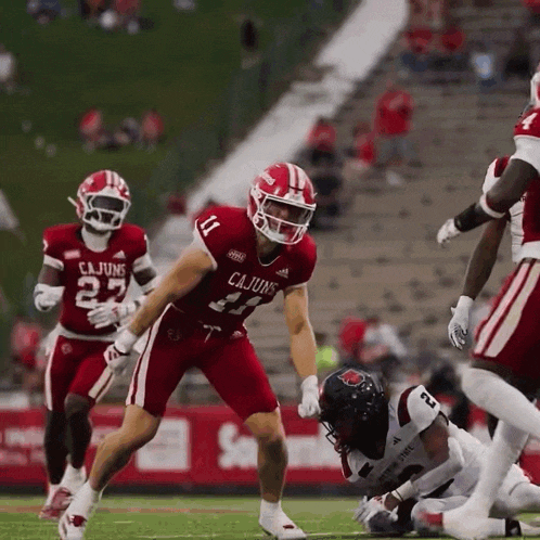 a football player wearing a jersey that says cajuns