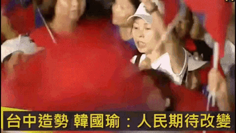 a group of people are standing in front of a sign that says ' chinese ' on it
