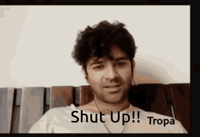 a man with ear buds says shut up tropa