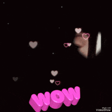 a woman 's face with hearts and the word wow