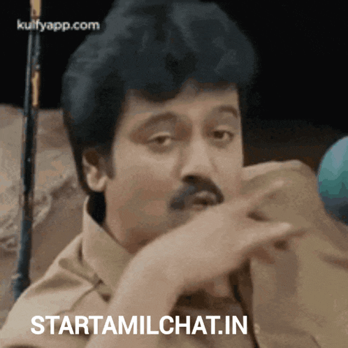 a man with a mustache is making a funny face and says startamilchat.in