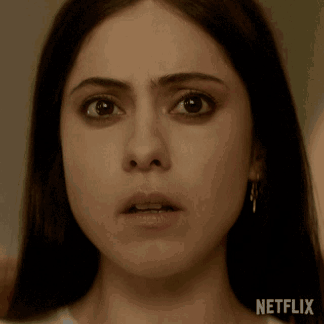 a close up of a woman 's face with the word netflix on the bottom