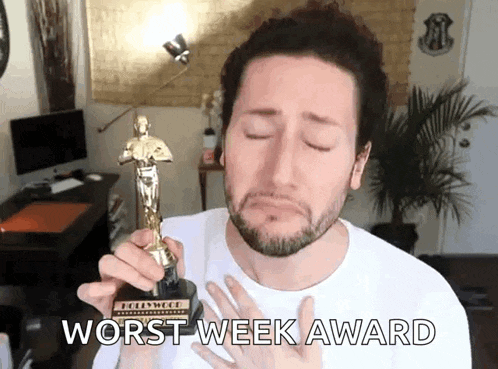 a man is holding an oscar statue with the words worst week award written below it