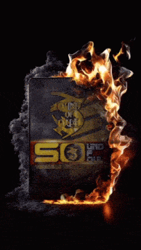 a sign that says ' 50 ' on it is surrounded by flames
