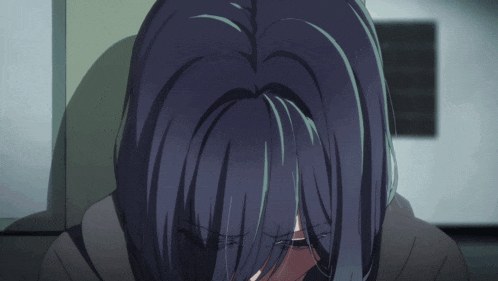 a close up of a person 's face with a dark background