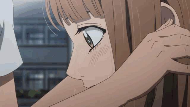 a close up of a person touching another person 's face