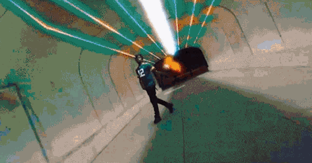 a man wearing a jersey with the number 12 on it is walking through a tunnel