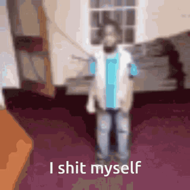 a blurry picture of a person with the words i shit myself on the bottom