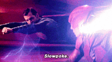 a man is fighting another man in a boxing ring and says slowpoke