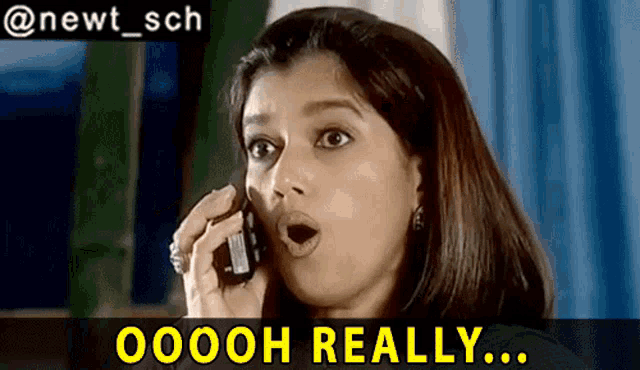 a woman with a surprised look on her face talking on a cell phone