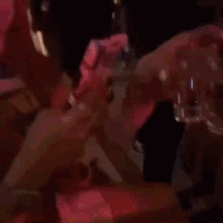 a blurred image of a person holding a container with a sticker that says ' ice cream ' on it