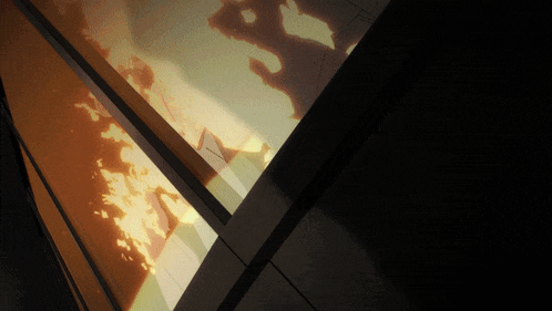 a shadow of a person is projected on a wall in a dark room