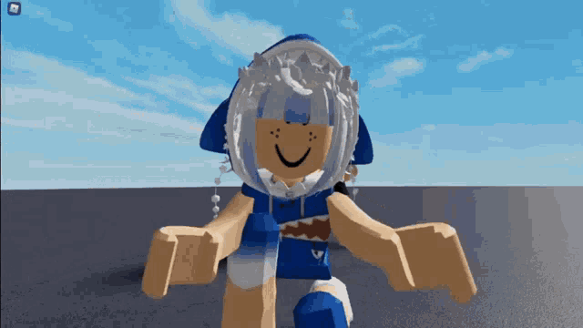 a girl in a shark costume is standing in front of a blue sky .
