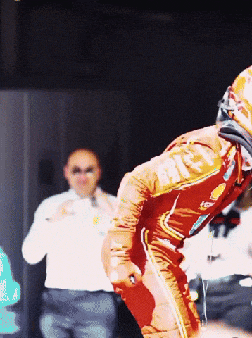 a race car driver wearing a helmet with the letters rs on it