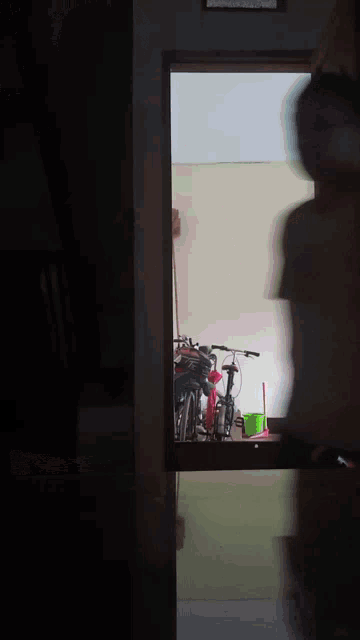 a blurry picture of a person standing in a doorway