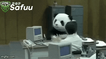 a panda bear is sitting at a desk next to a man in an office .