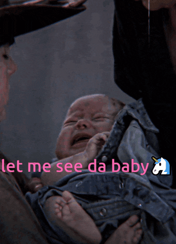 a crying baby is being held by a person with the words let me see da baby below it