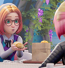 two cartoon characters are sitting at a table and one of them is holding a pastry