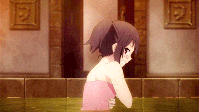 a girl in a bathtub with a pink towel on her back