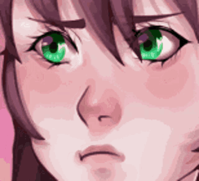 a close up of a person 's face with green eyes