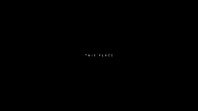 a white logo on a black background that looks like a uc logo .