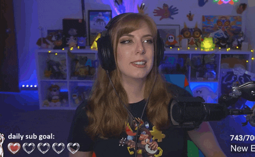 a woman wearing headphones stands in front of a microphone with a daily sub goal in the corner