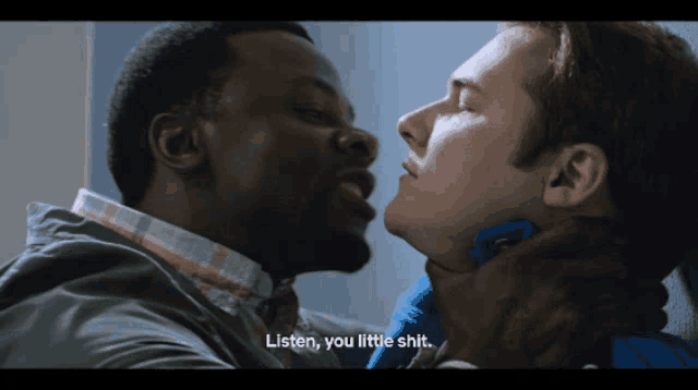 a man kissing another man with the words listen you little shit