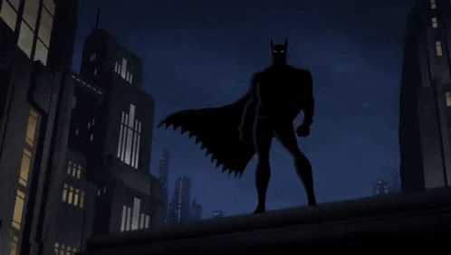 a cartoon of batman standing on top of a building