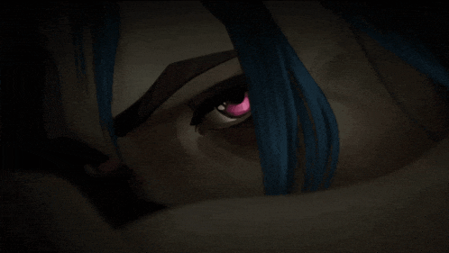 a close up of a person 's face with blue hair and a pink eye