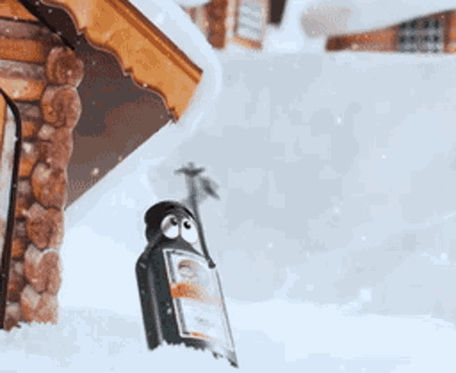 a bottle of beer is sitting in the snow near a log cabin