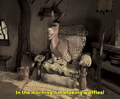 a donkey sitting in a chair with the words in the morning i 'm making waffles below it