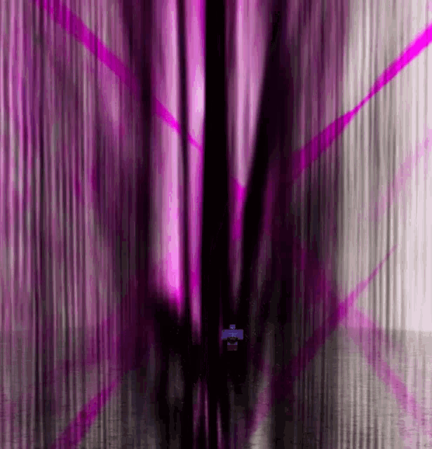 a purple and black background with a cross in the center