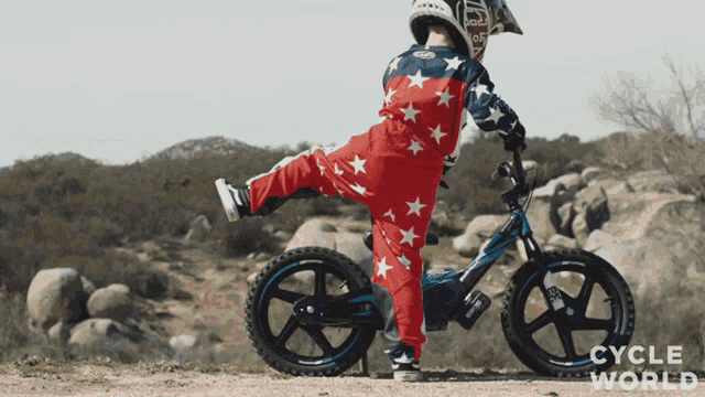 a person riding a bike with cycle world written on the bottom of the image