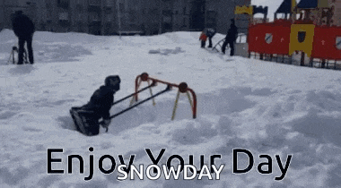 a child is playing in the snow with a sled .