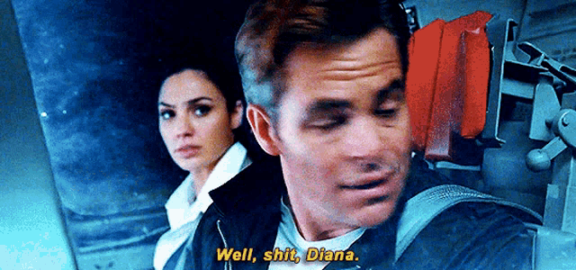 a man and a woman are sitting next to each other on a plane .