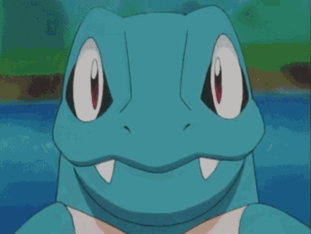 a close up of a cartoon character with its mouth open and teeth showing .