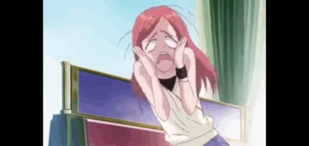 a girl with red hair is sitting on a bed with her eyes closed