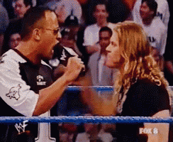 a fox 8 broadcast of a wrestling match between the rock and a woman